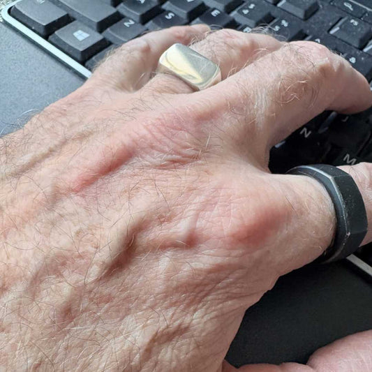 Eden Signet Ring worn on hand while typing on keyboard, showing everyday wearability and scale of sterling silver rectangle signet