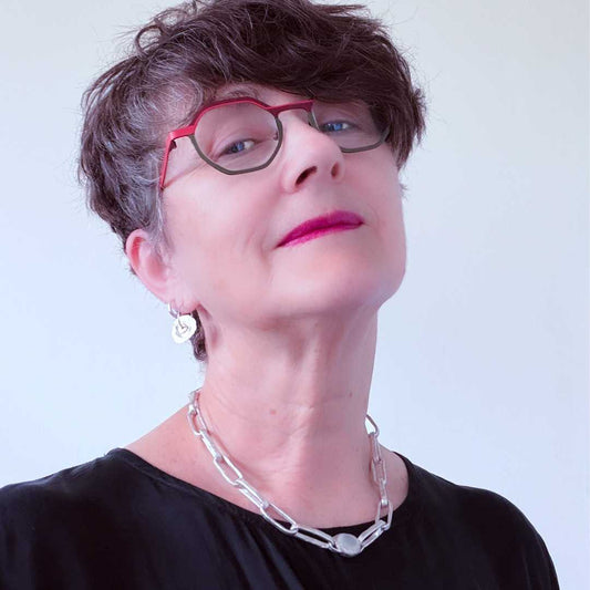 Oversized sterling silver paperclip chain necklace with oval moonstone bezel worn against a black top — Edition of One by HerbertandWilks