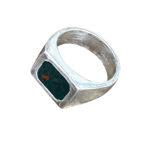 Rectangle Bloodstone Signet Ring on white background showing deep green stone with red flecks in sterling silver setting.