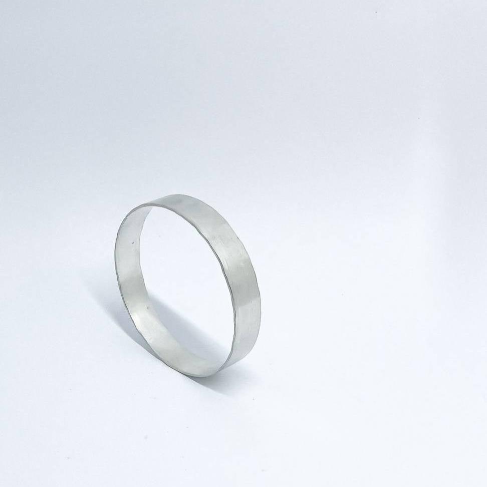 A heavy organic textured Sterling Silver Bangle