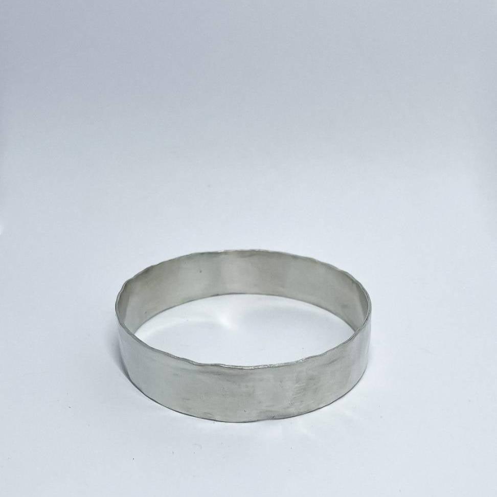 A heavy organic textured Sterling Silver Bangle