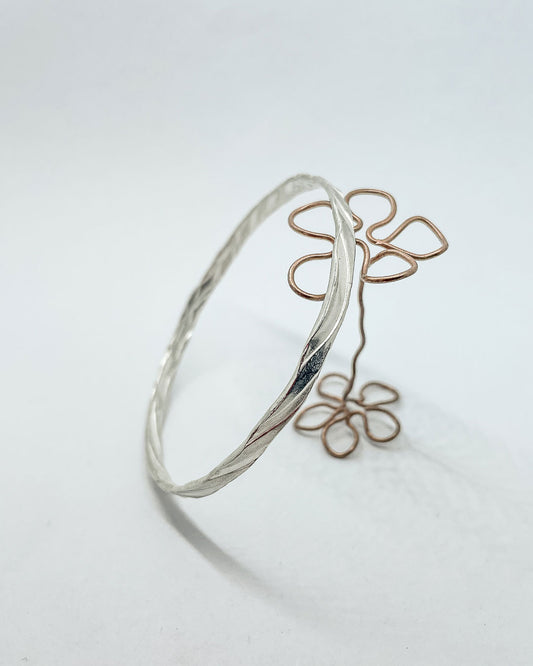 A sterling Silver bangle with a undulating texture on both the outside and inside of the band