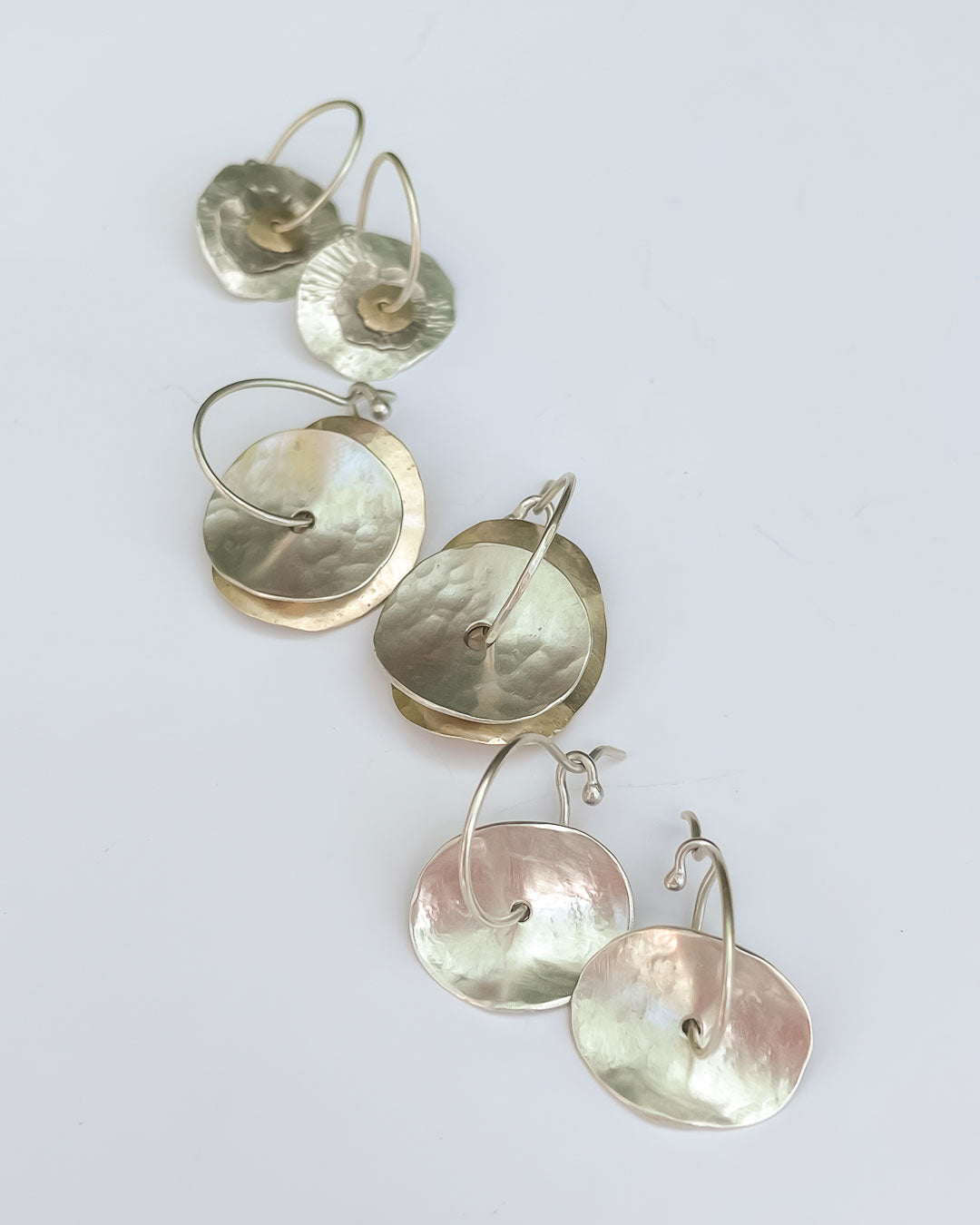 A flat Lay of other earrings from the Abstract Disc earring Range