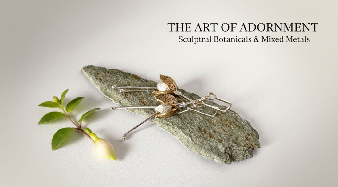 Bronze and sterling silver fuchsia flower earrings displayed on natural stone showing sculptural mixed metal jewelry design