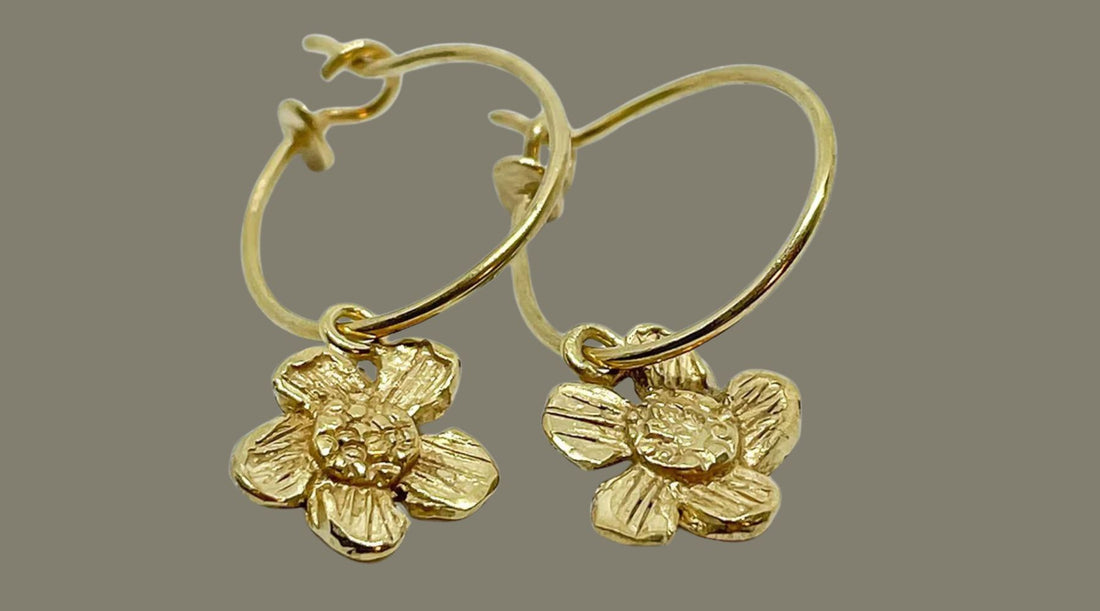 18ct gold plated Alpine Daisy charm earrings by HerbertandWilks — jewellery care guide for cleaning and protecting gold plated pieces.