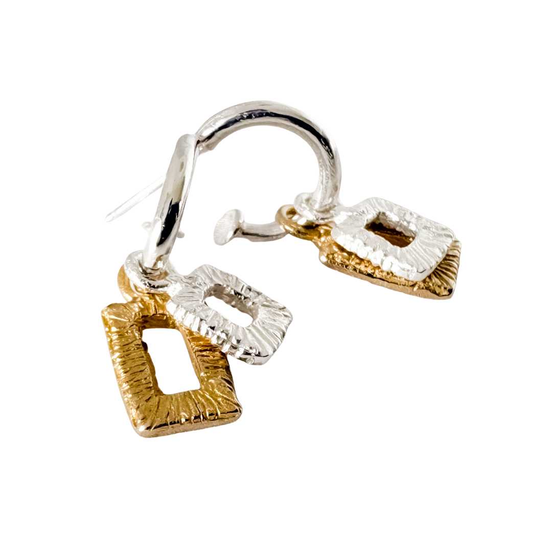 Mixed metal Strata charm earrings featuring large bronze rectangle frames with smaller sterling silver rectangles, shown stacked and side by side on a white background.