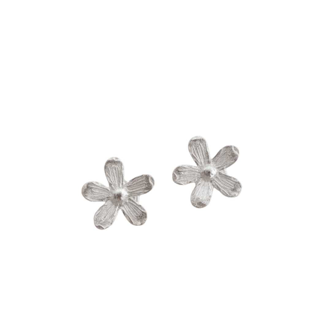 Flora sterling silver flower stud earrings pair on white background, handmade botanical jewellery