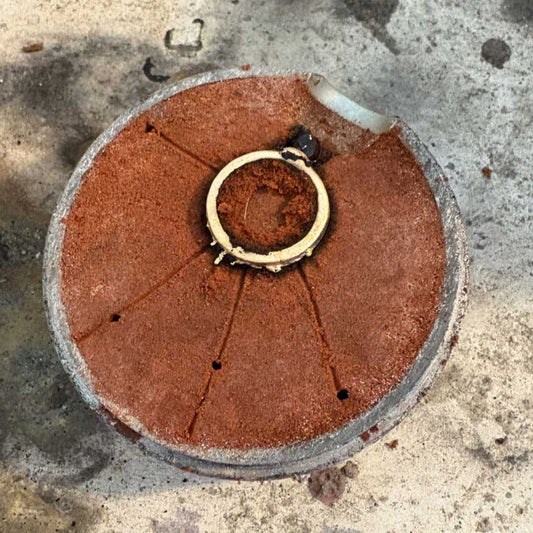 4mm Sandcast Gold Ring lying in one side of the sand mould immediately after casting, showing the handmade sandcasting process in the Auckland studio — HerbertandWilks Jewellery