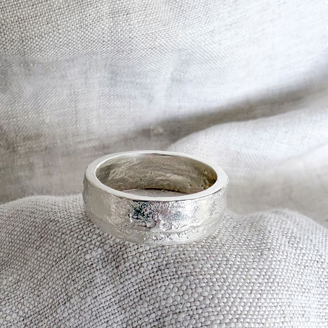 7mm sterling silver sandcast ring showing textured outer band and softened comfort-fit interior