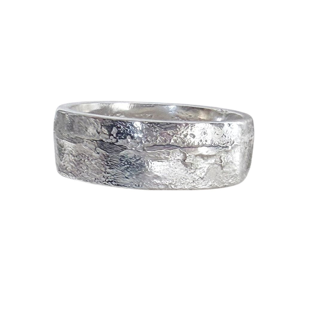 7mm sterling silver sandcast ring with textured surface and visible casting marks on white background