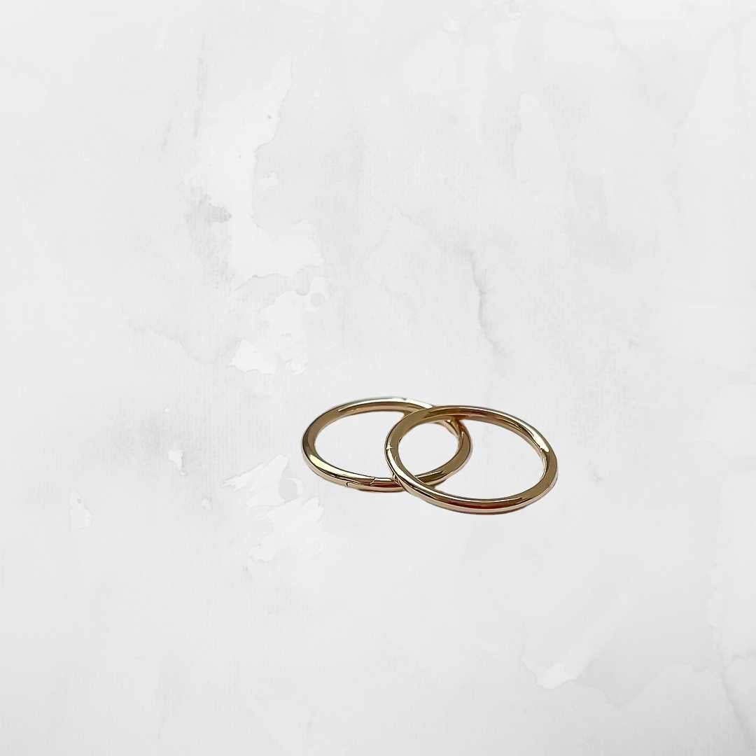 9ct gold sleeper earrings on light grey background - investment everyday hoops New Zealand