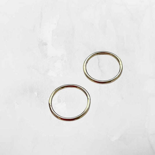 9ct yellow gold sleeper earring close-up - thin wire delicate hoop