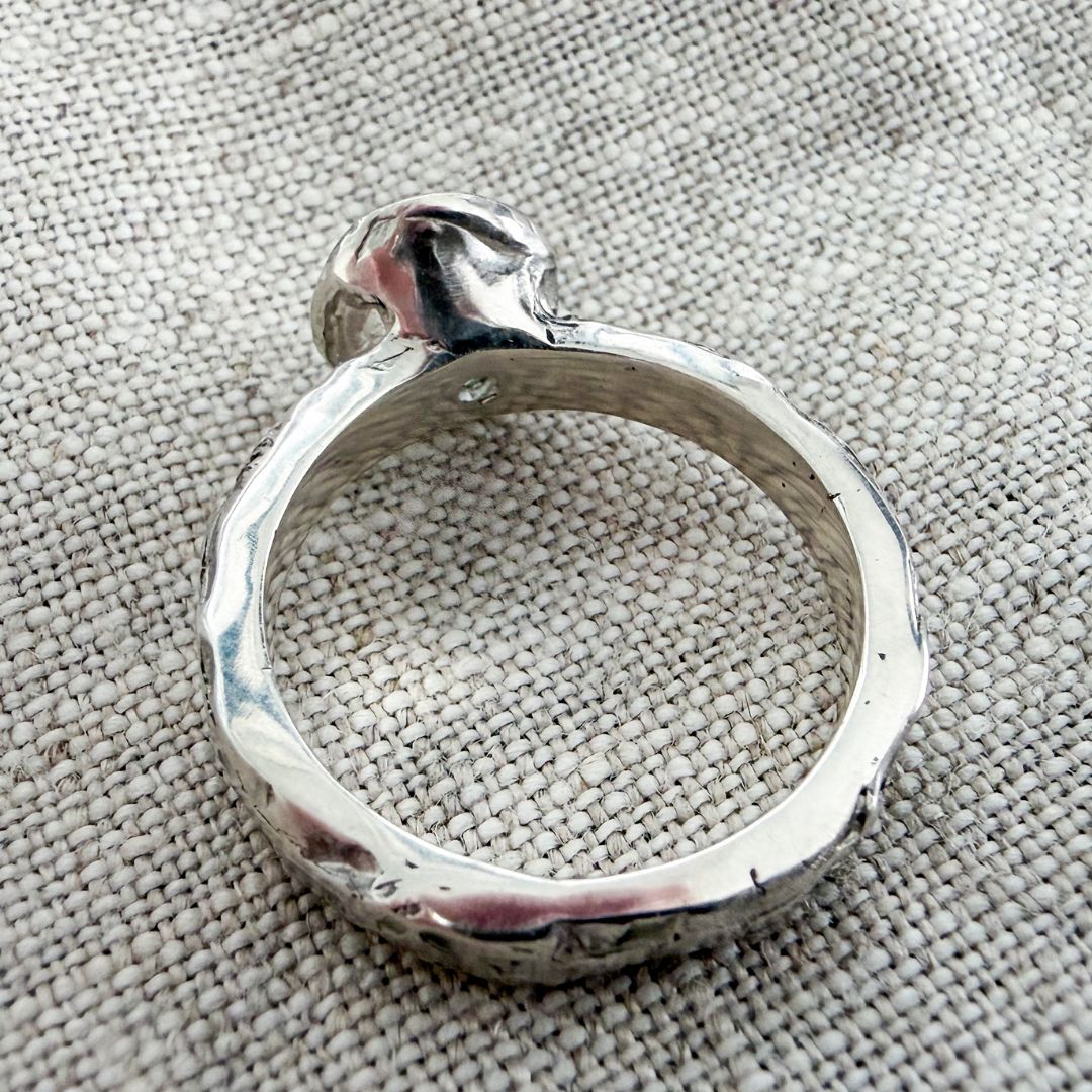 Back and inside view of the Manatū Ring showing the solid sterling silver band and handmade setting.