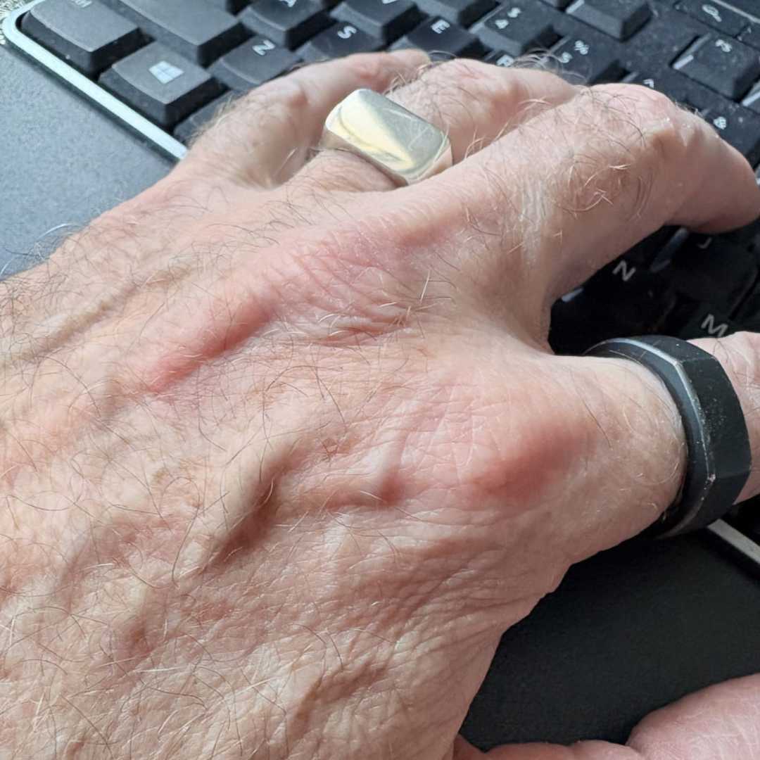 Eden Signet Ring worn on hand while typing on keyboard, showing everyday wearability and scale of sterling silver rectangle signet