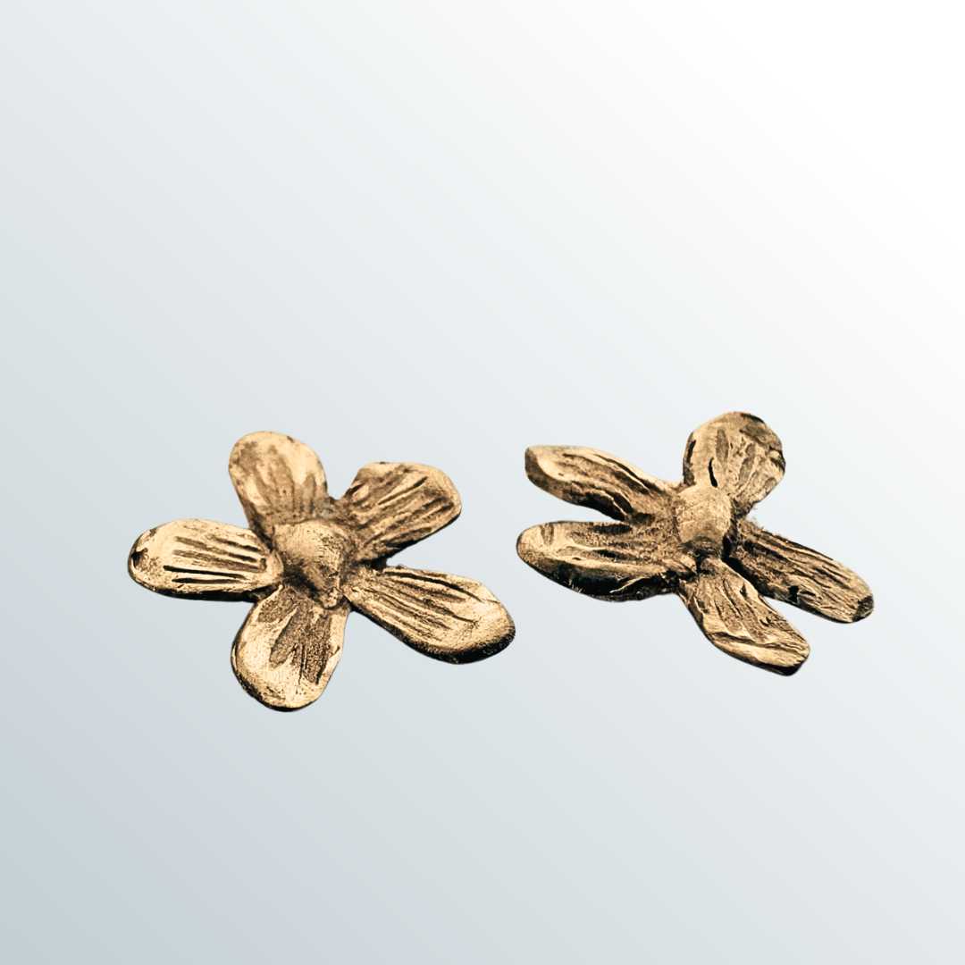 Flora Stud Earrings - 9ct yellow gold flower studs angled view showing three-dimensional sculptural contours and petal depth