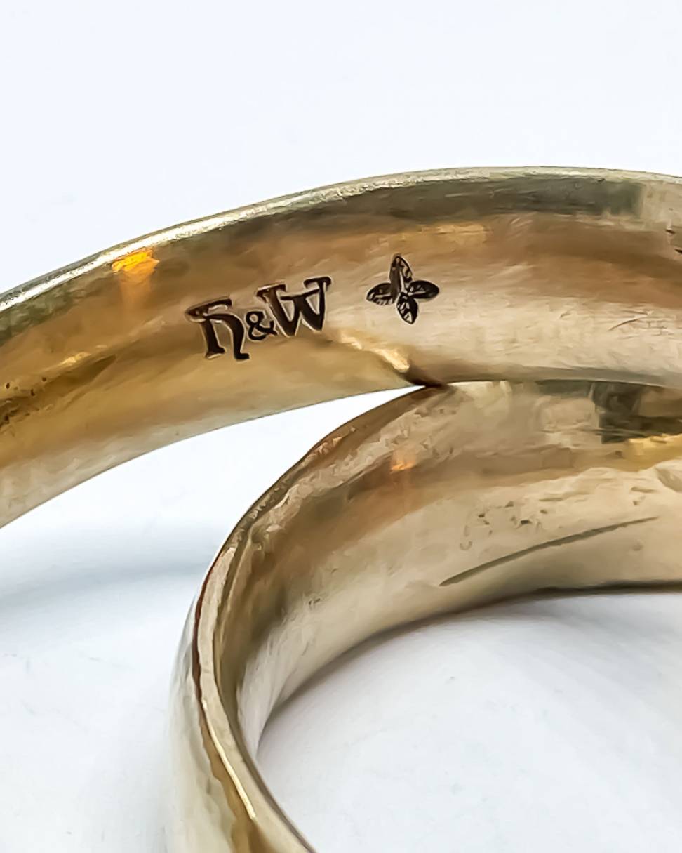 A close up of the makers mark inside one of the Bronze bangles