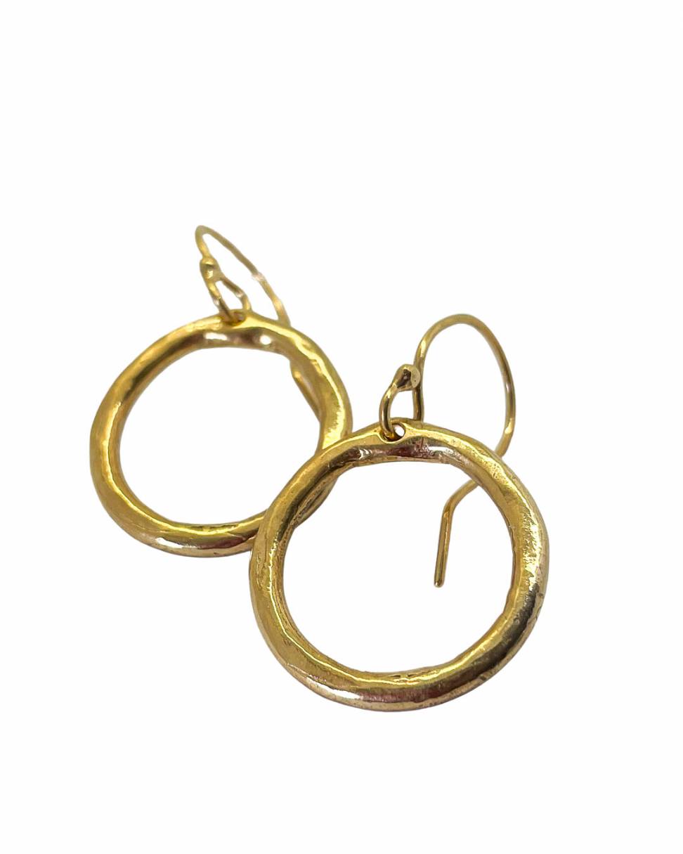 A close up of a pair of 18ct Gold plated organic Circle hoop earrings