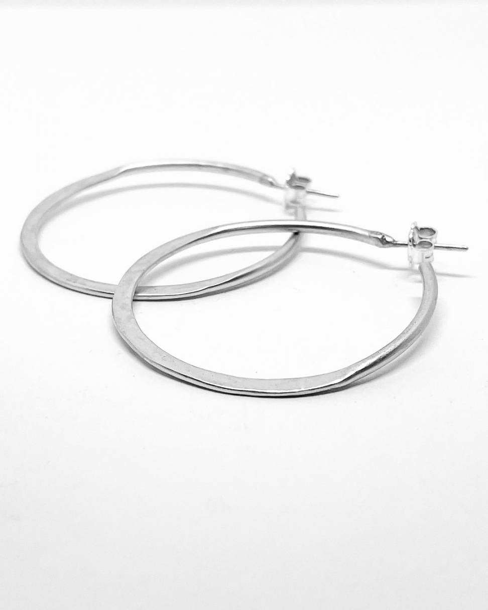 A pair of Sterling Silver Lunar Hoops showing the side profile