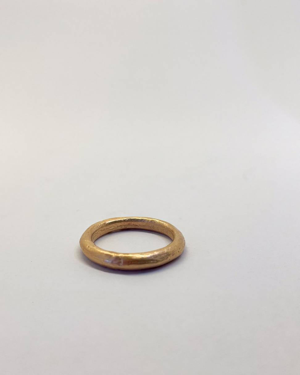 A 3mm 9ct Yellow Gold Sand Cast ring