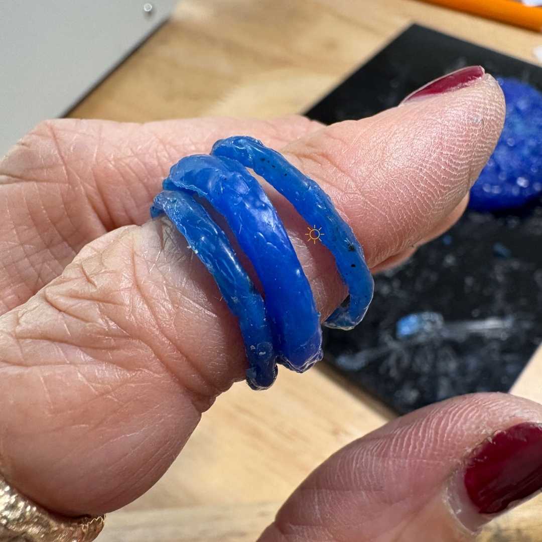 Three blue wax stacking rings on finger - choose two to cast in sterling silver at workshop