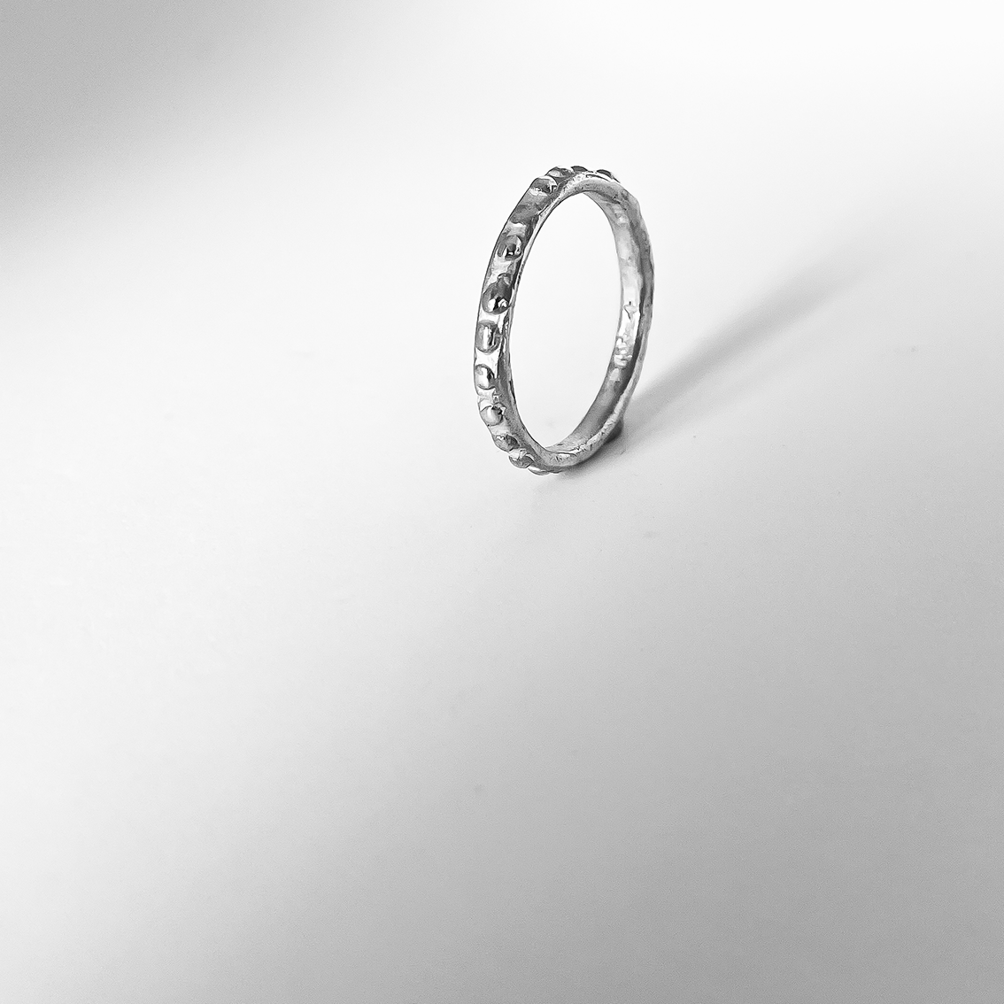 Organic Delicate Stacking Ring in Sterling Silver with a textured surface
