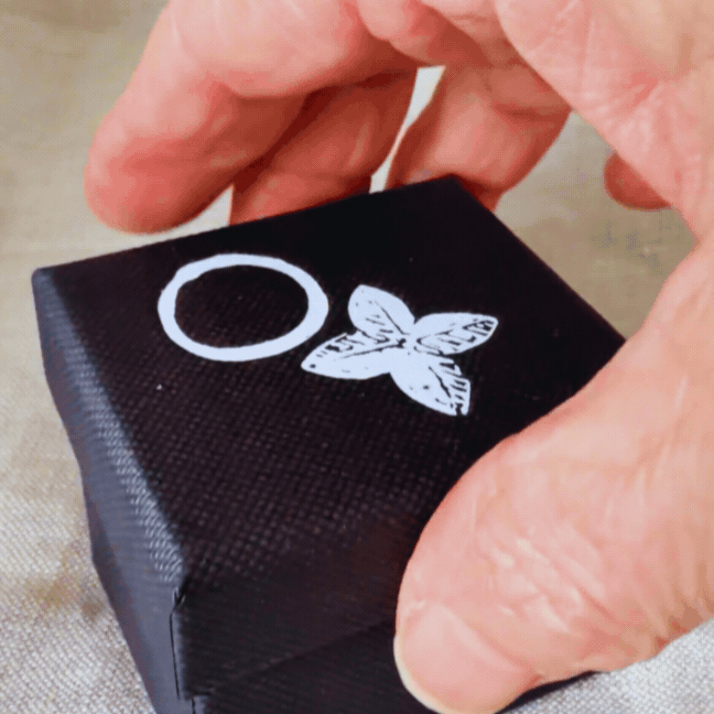 Kōwhai Signet Ring with natural citrine being revealed from a HerbertandWilks jewellery box