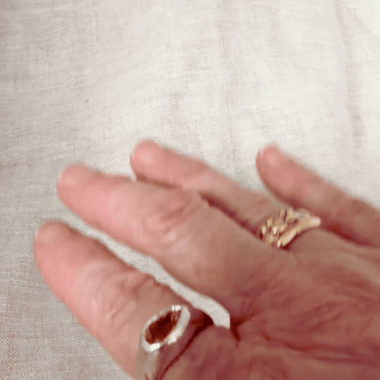 Kōwhai Signet Ring with natural citrine worn on the hand showing its shape and scale
