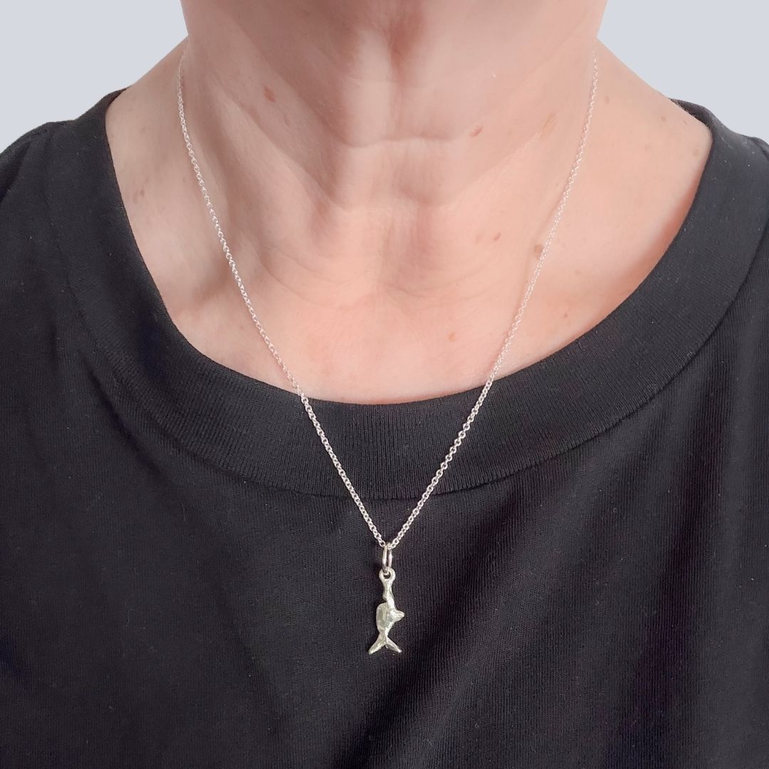 Mini Chomp sterling silver fish pendant worn on a 45cm round cable link chain.