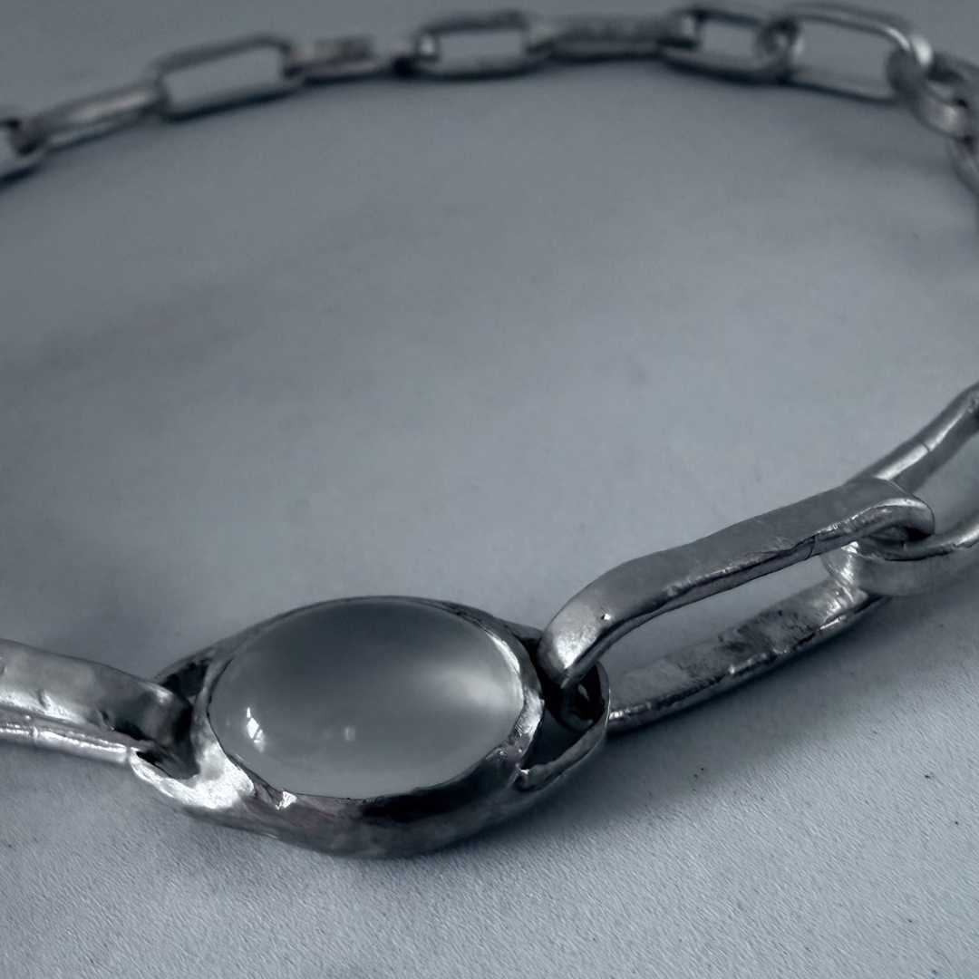 Oval moonstone showing natural adularescence glow in a hand-fabricated sterling silver bezel — Edition of One necklace made in Mt Eden, Auckland