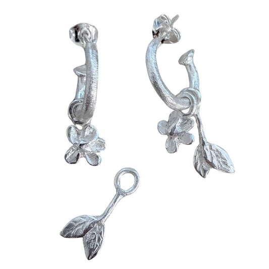 Handmade sterling silver Plum Blossom & Leaf earring charm set by HerbertandWilks Jewellery. This local Auckland jewellery piece features modular botanical charms on textured silver hoops, shown on a white background.
