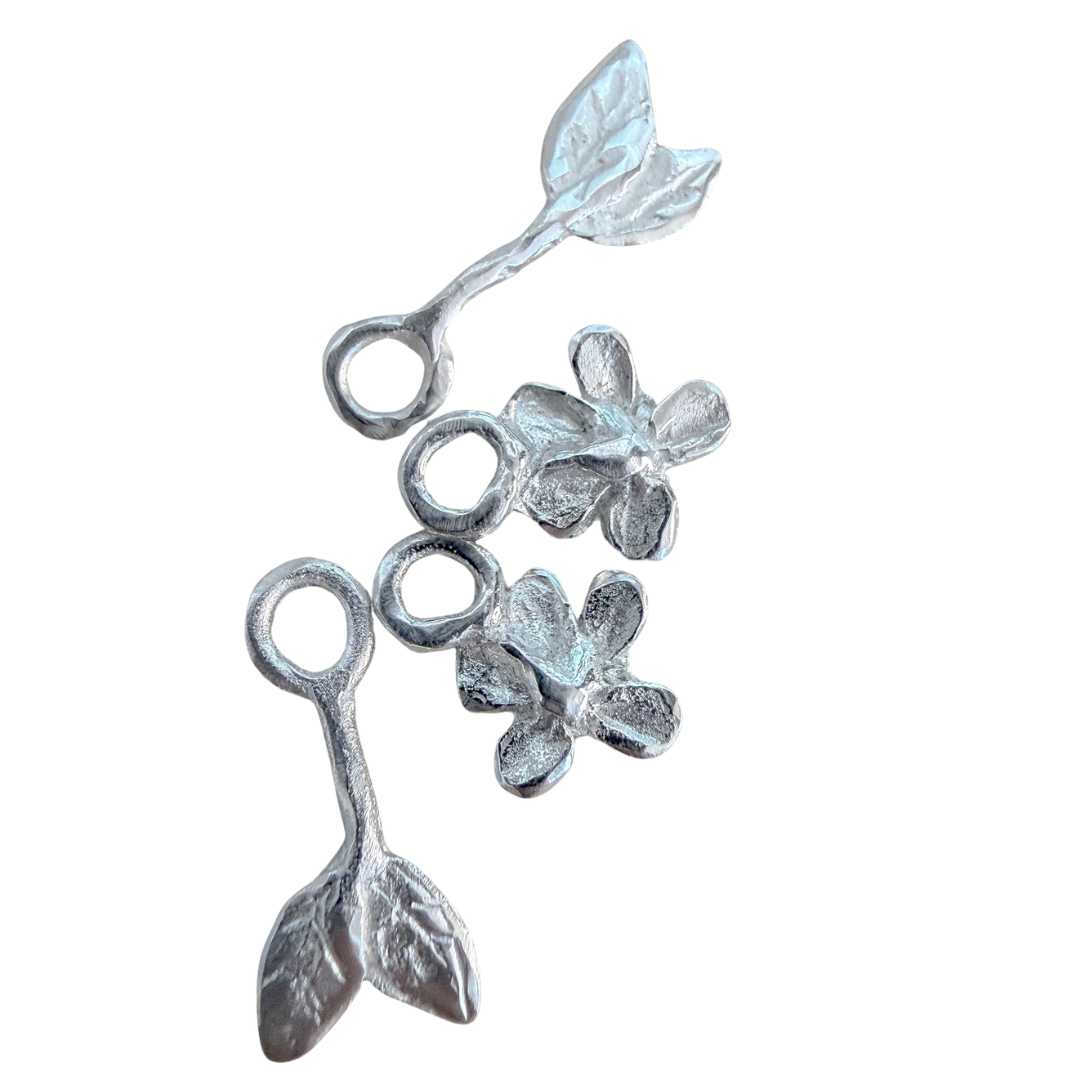 Handcrafted sterling silver Plum Blossom & Leaf earring charm set by HerbertandWilks Jewellery, featuring two flower and two leaf charms. This local Auckland jewellery piece is shown on a white background.