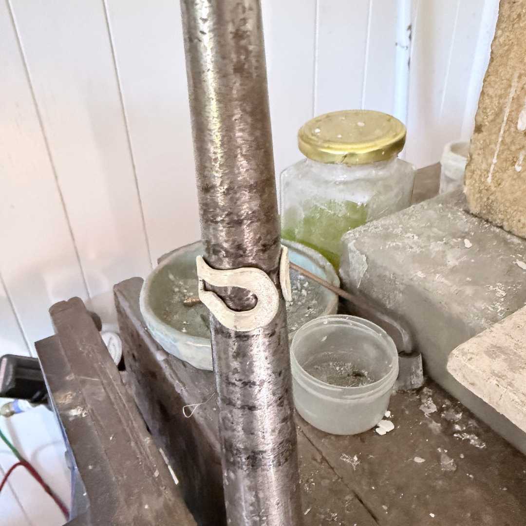 Sterling silver sheet stamped “STG” hallmark, cut and textured while still flat on a steel block on a jewellery workbench