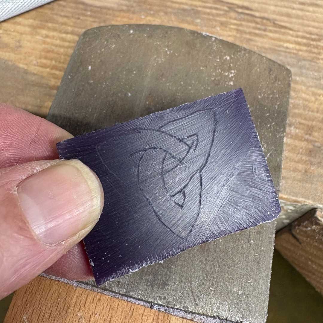 transferring the design of the pendant onto a wax sheet ready for carving