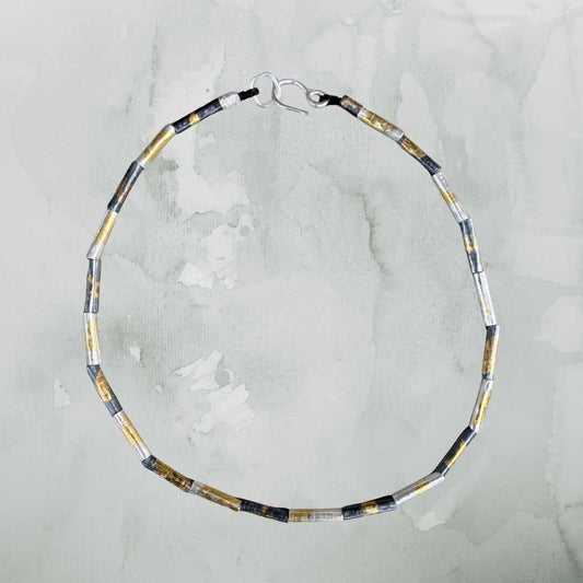 Wrapped beaded necklace in fine silver with Keum-Boo gold detail by HerbertandWilks on soft green background