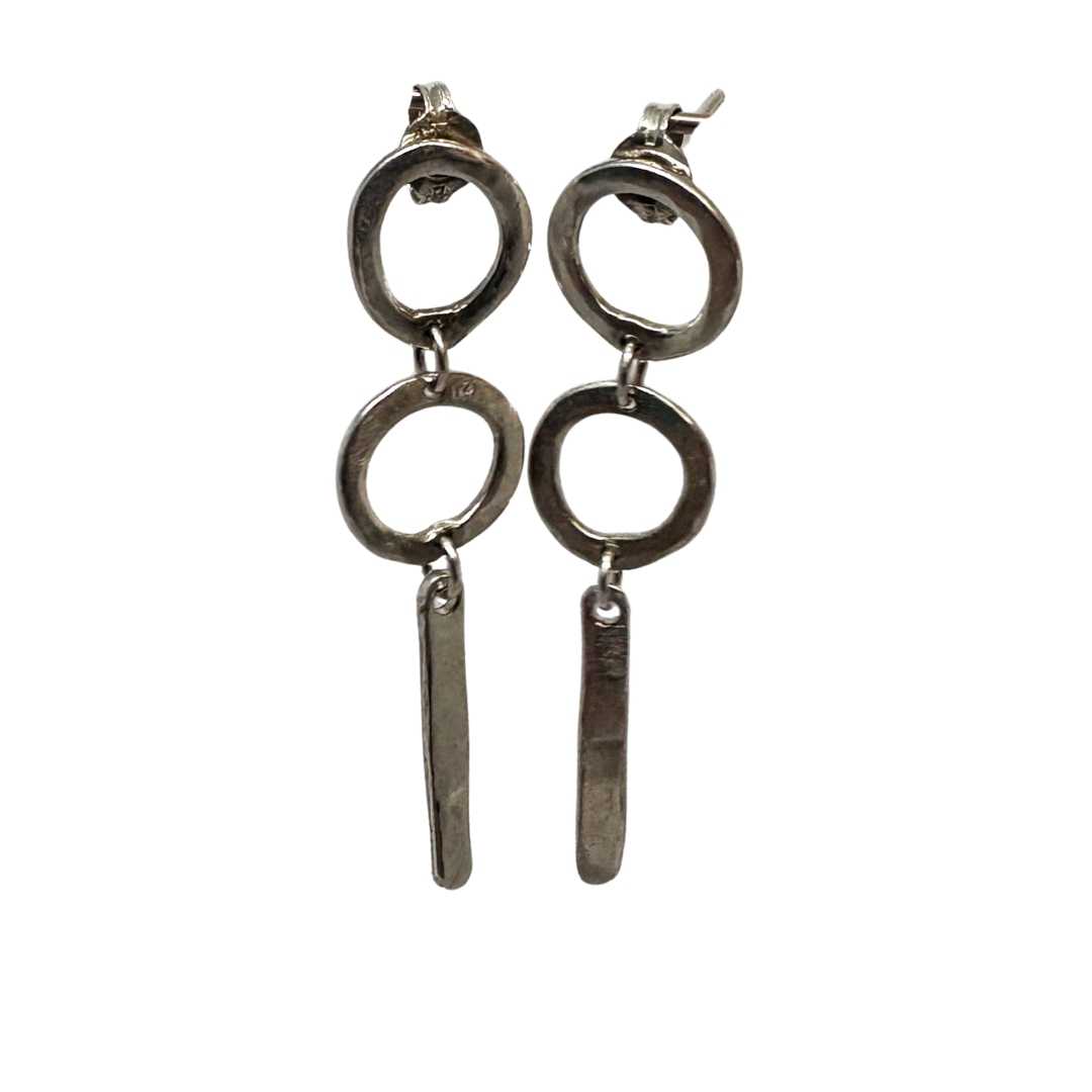 Front view of the Abstract Circle Earrings No. 25 in sterling silver on a white background showing sculptural circular forms and organic lines.