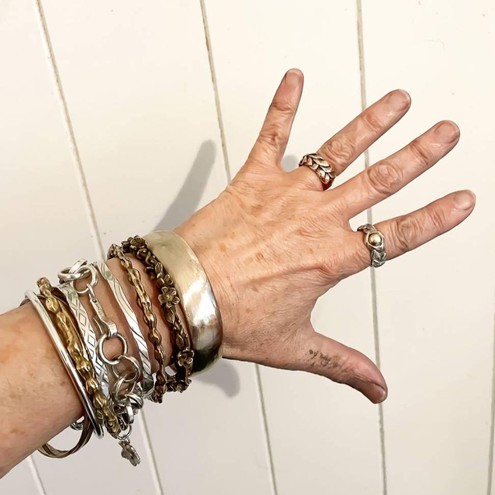 Handcrafted bronze bangle worn on wrist - sustainable NZ metalworkJewellery