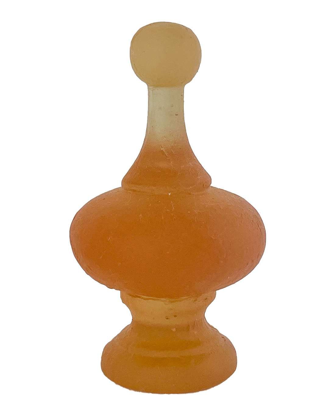 Cast glass finial sculpture in rhubarb pink, shown against a white background to highlight its soft colour and curved form.