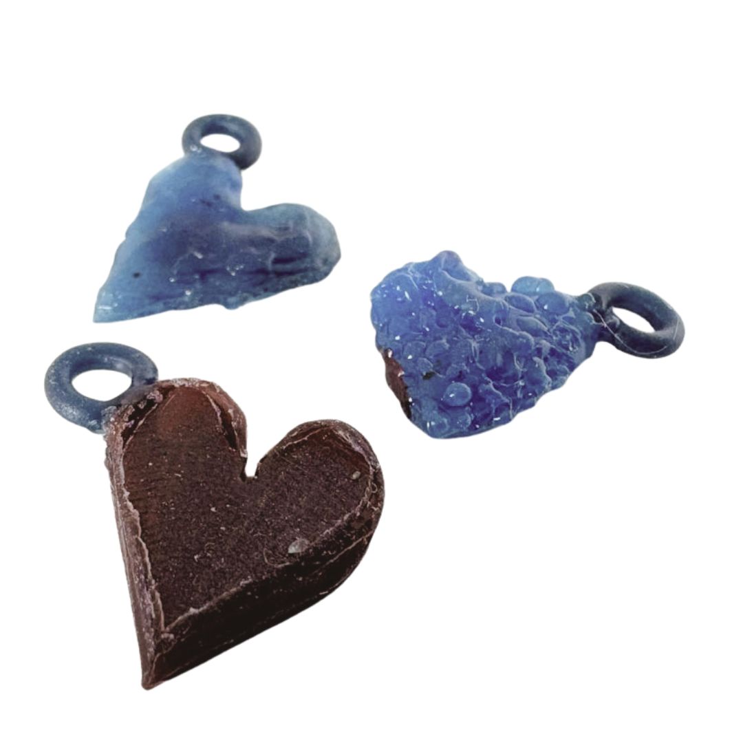 Three wax  charm styles - fingerprint, organic textured, and fluid drop