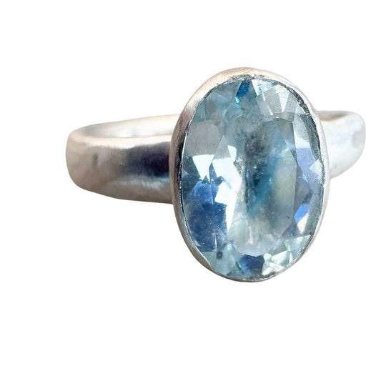 Front-on close-up of the #24 Manatū Ring showing the oval aquamarine’s facets and bezel-set sterling silver detail.