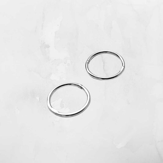 Sterling silver sleeper earring close-up - thin wire delicate hoop 925 silver