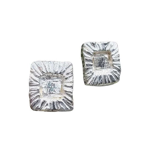 Front view of sterling silver Strata Rectangle Stud Earrings showing textured frame and smoother centre against a white background.