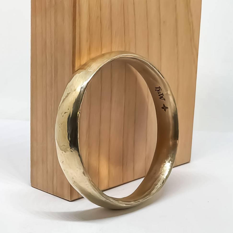 Wide bronze bangle profile view - substantial statement piece