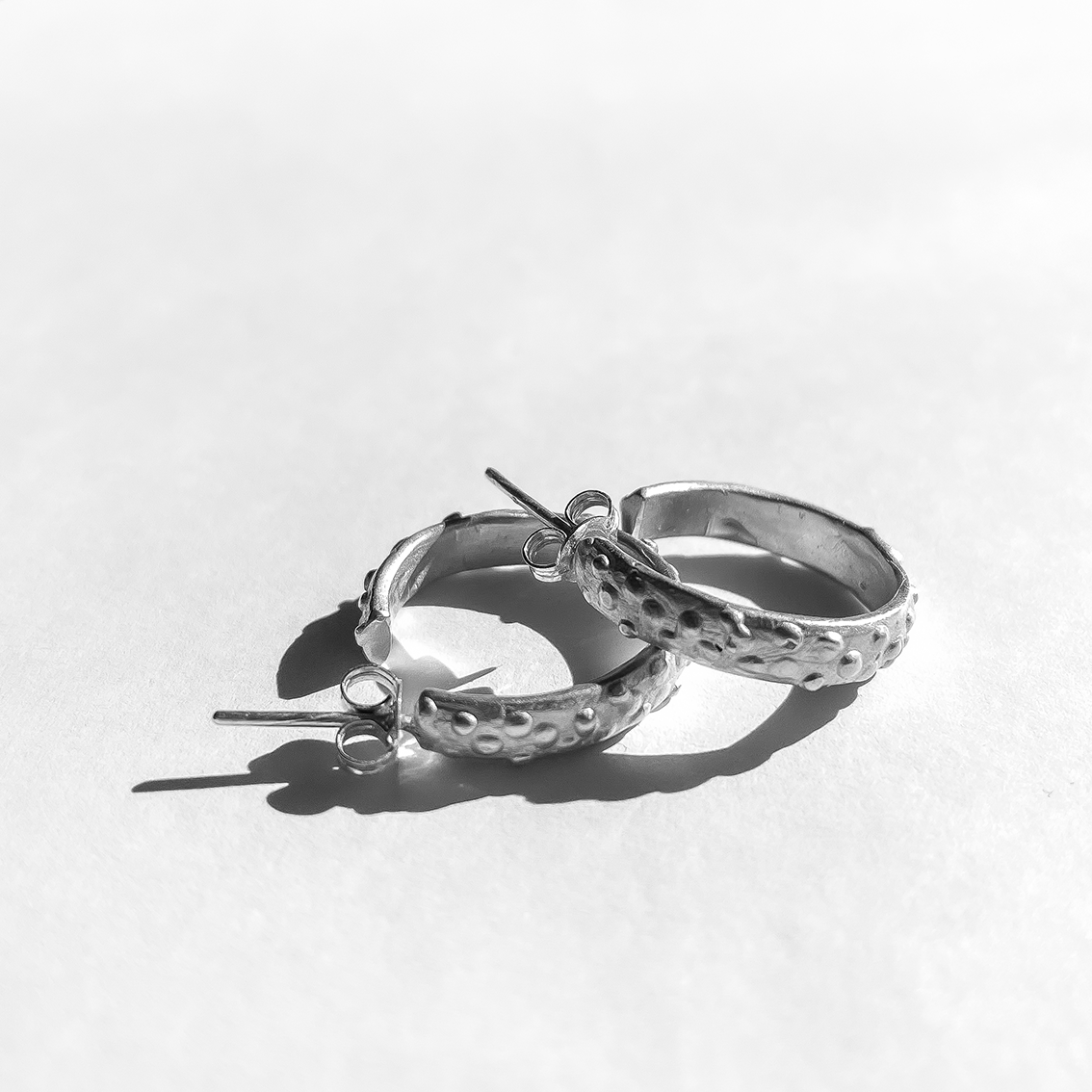 A pair of textured Sterling Silver hoop Earrings