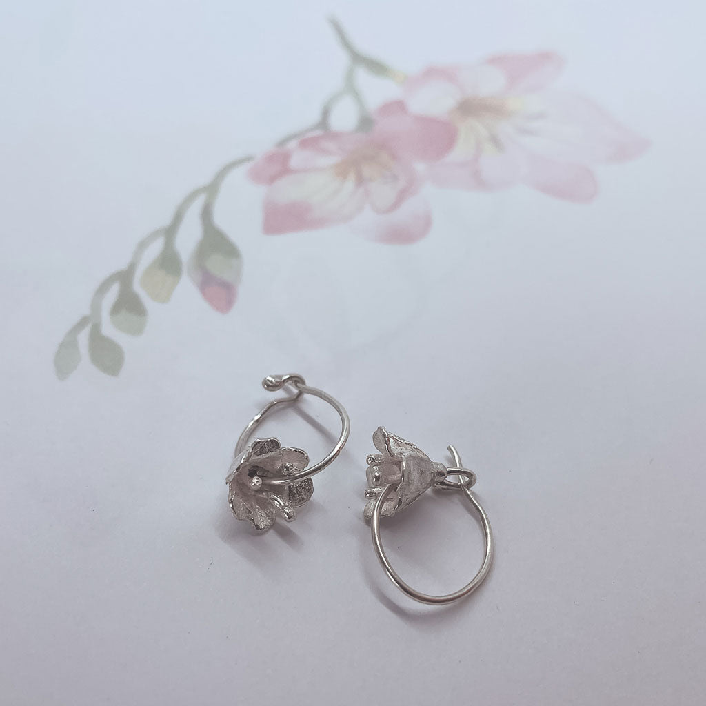A pair of delicate 3D Sterling Silver freesia Flower Hoop Earrings