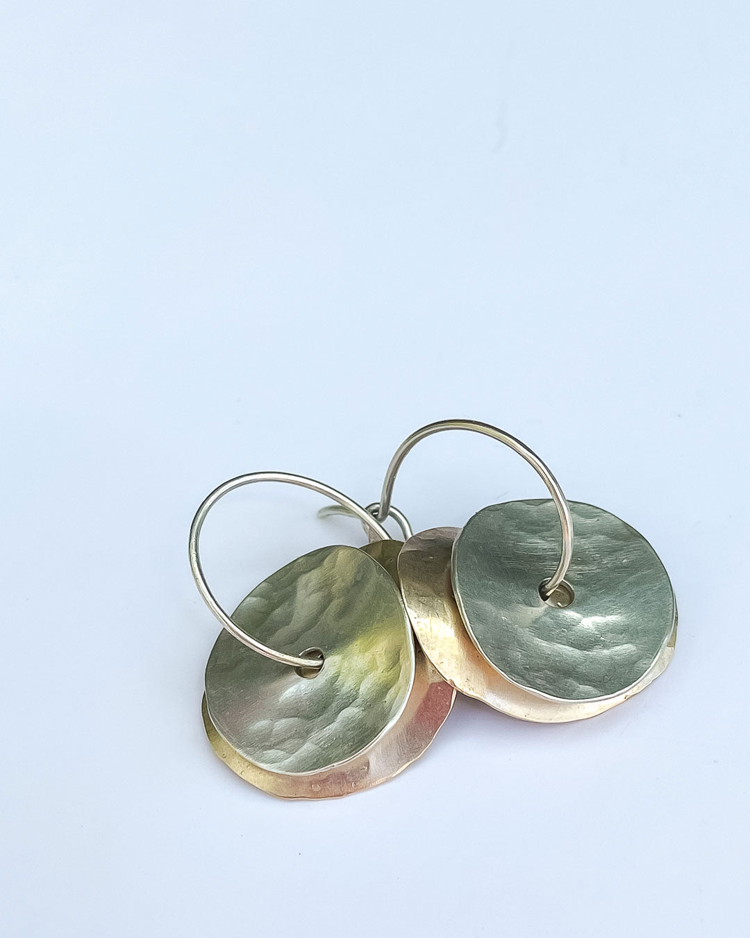 Multi Layered 9ct Gold and Sterling Silver earring formed with curved discs hanging from hoops