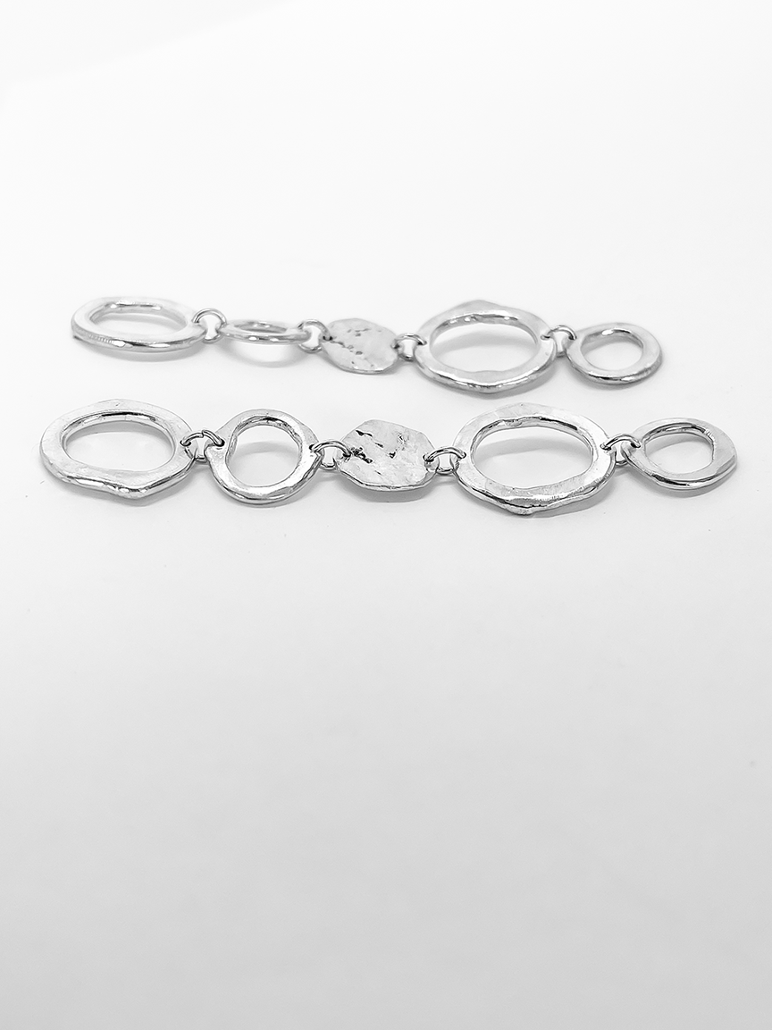 Sterling Silver Earrings made up of 5 abstract organic circles showing the side profile of the earrings