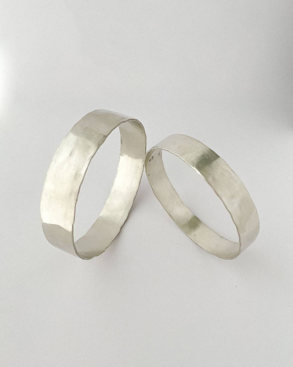 Two Heavy textured unisex bangles in Sterling Silver showing the surface and organic lines