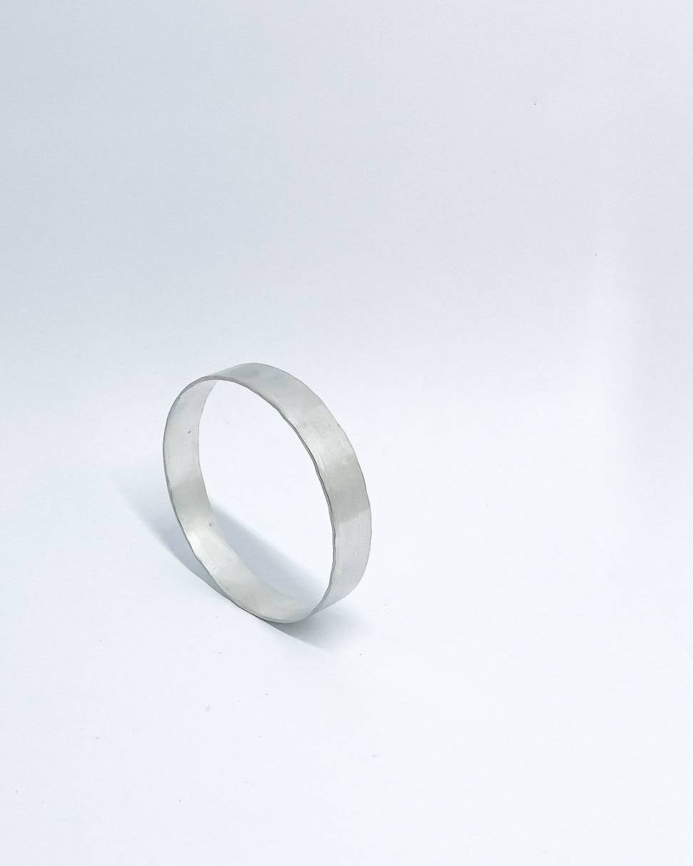 A heavy organic textured Sterling Silver Bangle