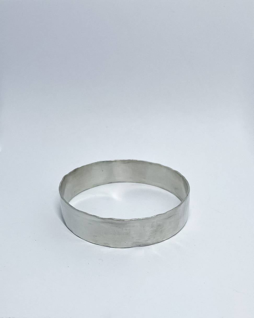 A heavy organic textured Sterling Silver Bangle