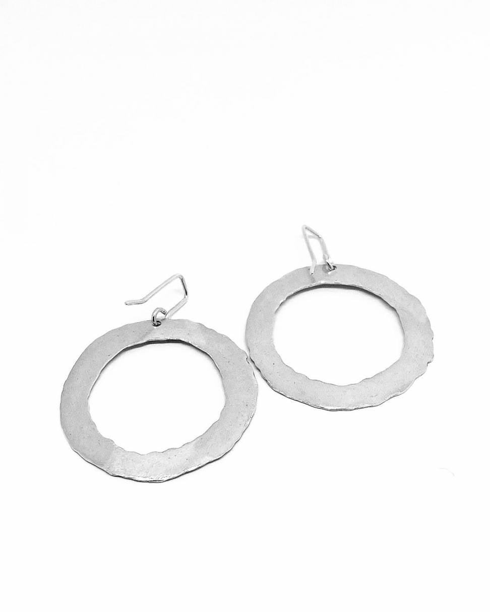 Back view of a pair of Sterling Silver textured Circle Hoop Earrings
